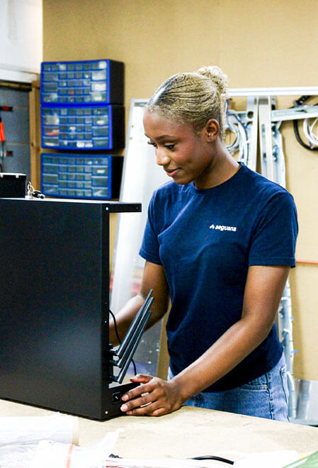 Woman working on vending machine