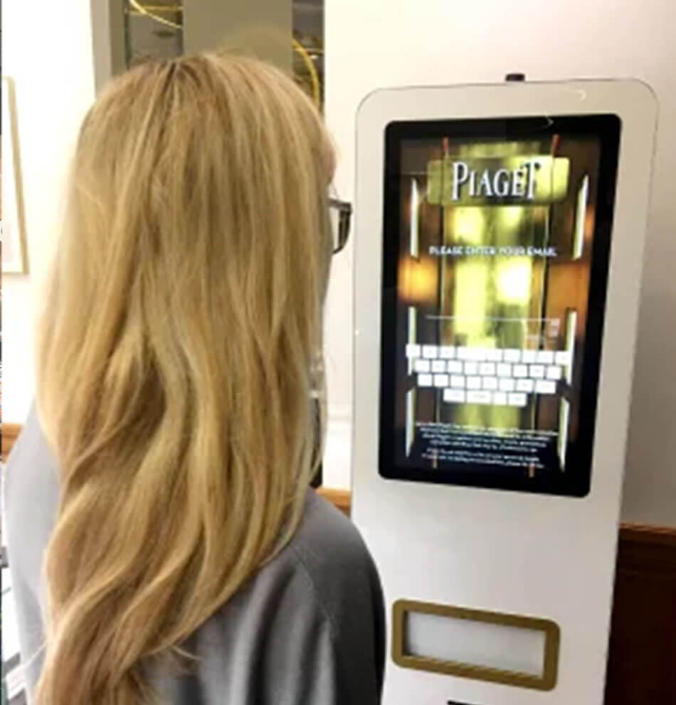 Woman using Piaget vending machine